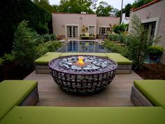 a fire pit sitting on top of a wooden deck