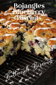 blueberry cobbler with white icing sitting on top of a grill