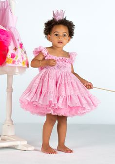 This beautiful Tutu Couture Petti Dress is beautiful and designed for your little princess to dance. The large bow at back gives it that extra special touch. Princess Style Sleeveless Twirl Dress With Ruffles, Sleeveless Princess Twirl Dress With Ruffles, Princess Style Twirl Dress With Ruffles For Dress-up, Cute Ruffled Smocked Dress For Dress-up, Playful Pink Dress With Smocked Bodice, Playful Pink Smocked Dress With Ruffles, Pink Dresses With Smocked Bodice And Ruffled Straps, Pink Smocked Dress With Ruffle Hem And Straps, Playful Pink Fitted Smocked Dress