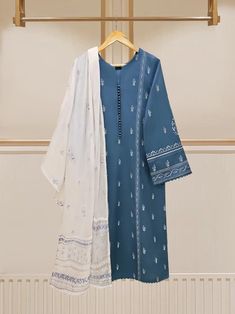 Introducing our vibrant and fashionable embroidered lawn shirt with dupatta perfect for adding a touch of elegance and style to your wardrobe. Made from high-quality lawn fabric, this shirt offers comfort and breathability, making it an ideal choice. Length : 44" Dupatta Fabric : Lawn y Blue Lawn Suit With Resham Embroidery In Shantoon, Blue Shantoon Lawn Suit For Eid, Eid Cotton Lawn Suit With Chikankari Embroidery, Blue Cambric Salwar Kameez With Naqshi, Eid Cotton Lawn Suit With Naqshi Embroidery, Eid Cotton Lawn Suit With Naqshi Detail, Eid Chikankari Embroidery Cotton Lawn Suit, Eid Chikankari Cotton Lawn Suit, Unstitched Blue Lawn Suit For Summer