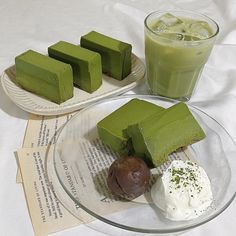 there are four different desserts on the plate next to each other and one is green