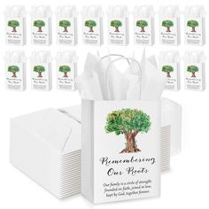 a bunch of white paper bags with trees on them and the words, remembrance ones