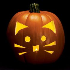 a pumpkin with a cat's face carved into it