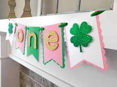 a st patrick's day banner hanging on the mantle