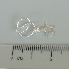 Star charm dangler, open ended sterling silver ear cuff. Dimensions: 6 x 8 mm Star: 8 x 8 Weight: .90gm Price listed is for ONE PIECE These are made of 925 hypoallergenic sterling silver. pieces come with a 925 stamp. Can be packaged in a gift box. I can include a personal message from you if needed You are welcome to contact me at... bhavnakwintra1956@gmail.com For more beautiful pieces from my shop, please browse 👇 TOE RINGS: https://www.etsy.com/your/shops/TheSilverGame/tools/listings/sectio Adjustable Silver Ear Cuff With Ear Wire, Silver Star-shaped Pierced Cartilage Earrings, Silver Star-shaped Cartilage Earrings With Pierced Design, Dainty Dangle Sterling Silver Ear Cuff, Dainty Sterling Silver Dangle Ear Cuff, Silver Nickel-free Ear Cuff Gift, Silver Nickel-free Ear Cuff For Gift, Sterling Silver Star Cartilage Earring, Adjustable Celestial Single Cartilage Earring