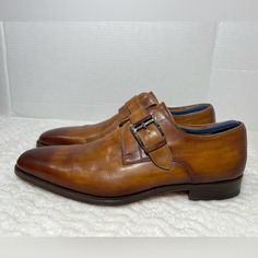 Magnanni 'Marco' Monk Strap Cuero Loafer Slip On Shoe Brown 13276 Size 9.5m Euc. Shoes Is In Used Condition And Has Signs Of Wear. Right Pair Has A Small Scratch On The Front Side. Beside That Shoes Is In Great Condition. Upper Leather Is In Great Condition And Very Clean, Inside Is Super Clean And The Soles Are In Great Condition. Nice Comfortable Italian Shoes For Casual Wear Or Business Wear. Condition Is Pre-Owned. Shipped With Usps Priority Mail. Sold As Pictures. Thank You! Feel Free To Message Me For Any Questions. Thank You Designer Monk Strap Slip-on Shoes For Semi-formal Occasions, Monk Strap Shoes With Almond Toe For Galas, Business Casual Monk Strap Shoes With Branded Insole, Monk Strap Shoes With Stitched Sole For Galas, Formal Monk Strap Shoes With Stitched Sole, Designer Slip-on Monk Strap Shoes With Leather Sole, Designer Monk Strap Slip-on Shoes With Leather Sole, Semi-formal Slip-on Monk Strap Shoes With Stitched Sole, Semi-formal Almond Toe Monk Strap Shoes With Stitched Sole