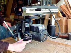 a man is using a circular saw to cut wood with a table sawtoother