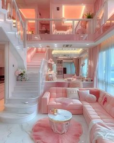 a living room filled with pink furniture and lots of white stairs leading up to the second floor