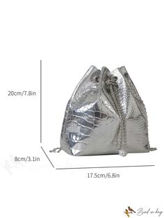 a silver purse is shown with measurements