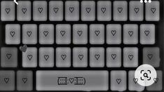 a computer keyboard with hearts on it and the words love spelled in white letters below