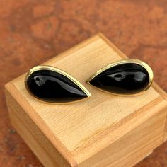 Estate/ Vintage 14KT Yellow Gold Teardrop, Genuine, Black Onyx Omega Back Earrings Measures approx.: 30mm x 25mm Weight: 7.20 grams Omega Back Closure Stamped 14K Excellent estate condition! Staple black onyx earrings you can wear with just about anything! Wear them by themselves or interchange earring charms in them!  Check out all our omega back earrings + our entire jewelry collection! Please let us know if you have any questions. International buyers: you are responsible for paying any VAT/C Elegant Black Cabochon Earrings, Black Cabochon Earrings For Evening, Evening Black Cabochon Earrings, Luxury Black Drop Jewelry, Black Drop Earrings For Formal Occasions, Classic Black Teardrop Earrings, Classic Black Drop Jewelry, Black Teardrop Earrings For Formal Occasions, Classic Black Pear-shaped Jewelry