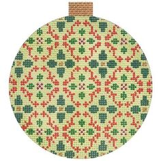 a cross stitch christmas ornament is shown in red, green and yellow colors