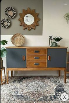 a living room area with a rug, mirror and furniture