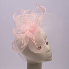 This comb head accessory is the peak of elegance. Because it is made of crinoline, it will delicately add a pop of color to your ensemble. Material: Polyester Handmade Item. Origin: Made in Taiwan Color on screen may vary from actual merchandise due to monitor restrictions or dye lots. Cocktail Pink, Monies Jewelry, Handmade Comb, Cotton Loungewear, Diva Boutique, Hair Bonnet, Boutique Stores, Fascinator Hats, Personalized Decor