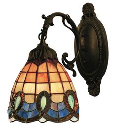 a wall light with a stained glass shade