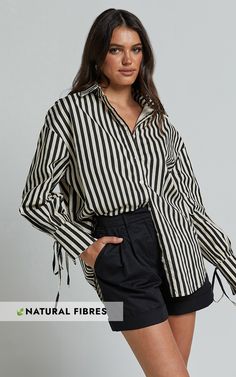 Elevate your everyday style with the effortlessly chic Cazie Shirt - Tie Cuff Long Sleeve Shirt in Black & Cream Stripe. This versatile top is perfect for both casual and dressed-up occasions, making it a must-have addition to your wardrobe. Crafted from high-quality cotton, this shirt offers both comfort and durability that will last all day long. The black and cream stripe pattern adds a classic touch to any outfit, while the tie cuff detail adds a trendy twist. With its standard collar an Chic Button-up Top With Tie Sleeves, Casual Shirt With Tie Sleeves, Casual Work Shirt With Tie Sleeves, Chic Tie Sleeves Button-up Tops, Workwear Button-up Top With Tie Sleeves, Cotton Shirt With Tie Sleeves And Long Sleeve, Chic Cotton Shirt With Tie Sleeves, Casual Long Sleeve Shirt With Tie Sleeves, Chic Shirt With Tie Sleeves For Workwear