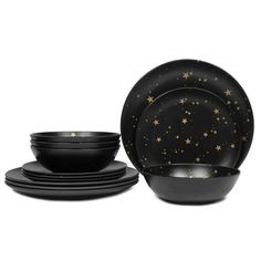 black dinnerware with gold stars on it