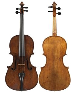 an old violin is sitting next to another one on a white background with clippings