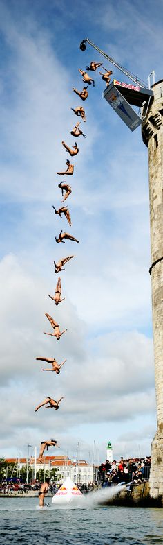 a group of people doing tricks on the water