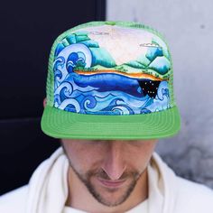 - Canvas front panel with mesh back.- Comfortable flat brim trucker hat.- Adjustable snapback with custom stitch work.- Rugged and durable for your life's adventures. Stitch Work, Painted Artwork, Hand Painted Artwork, Comfortable Flats, Life Is An Adventure, Yokohama, Kiwi, Trucker Hat, Mesh