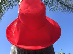 "Red is symbolic of love - this sunhat will make a great Valentine's Gift And you can personalize this hat by selecting the size for either your significant other, friend, or yourself A little pop of color to complete any outfit - brilliant red wide brim sun hat. A gorgeous shade of red makes any outfit come alive and here you have a very beautiful wide brim sun hat in stunning red. The sunhat has a very chic look to it because of its very wide brim and yet it is very functional by providing sun Adjustable Wide Brim Red Sun Hat, Adjustable Red Wide Brim Sun Hat, Wide Brim Red Bucket Hat For Summer, Red Wide Brim Bucket Hat For Summer, Adjustable Red Sun Hat For Summer, Red Fedora Sun Hat For Beach, Red Brimmed Bucket Hat For Summer, Red Wide Brim Hat For Vacation, Red Sun Hat With Short Brim For Beach