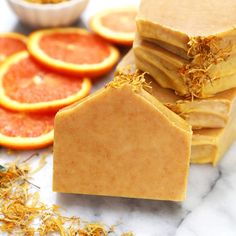 soap bars with orange slices and dried herbs on them for sale at poshmark