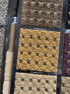 carpet samples are laid out in rows and arranged on top of each other for display