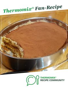 there is a pan with some food in it on top of a wooden table and the words thermomiia fan - recipe