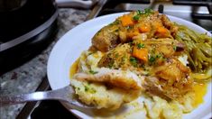 a white plate topped with chicken and mashed potatoes