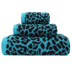 leopard print towels are stacked on top of each other