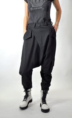 "Harem Pants, Black Pants, Women Pants Black loose cotton pants, casual extravagant black pants. Woman black pants. Very comfortable loose pants. Asymmetric Harem Pants with two pockets. This pant is very convenient for your daily life. All my clothes are unique and boutique. Model wearring size: SIZE S (US 6, UK 10, Italian 40, French 38, German 36, Japan 7) bust: fits bust around 35.5\" / 90cm Waist: fits waist around 28\"/ 71cm Hips: fits hips around 38\"/ 97cm For overall height: 5'5\" / 165 Baggy Wide Leg Harem Pants Hip Hop Style, Baggy Black Parachute Wide-leg Pants, Black Baggy Wide-leg Parachute Pants, Black Cotton Harem Pants With Side Pockets, Baggy Black Cotton Harem Pants, Black Cotton Harem Pants For Fall, Black Hip Hop Harem Pants With Pockets, Black Wide-leg Harem Pants With Side Pockets, Baggy Drop Crotch Harem Pants With Side Pockets