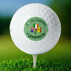 a golf ball with the words 5 culture's four - leaf clover on it