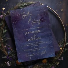 two purple and gold wedding cards on top of each other with stars in the sky