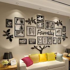 a living room with pictures on the wall and family tree in the center, along with other decorations