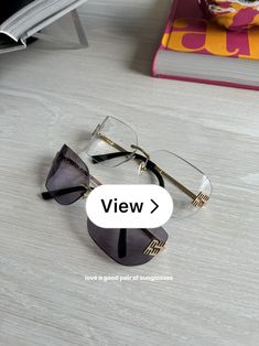 a pair of glasses sitting on top of a table