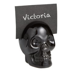 a black skull with a note pinned to it's head that says victoria on the side