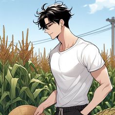 a man standing in front of a corn field holding a straw hat and looking down at the ground