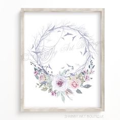 a white frame hanging on the wall with flowers and birds