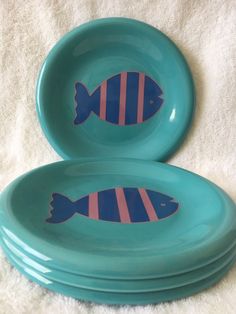 two blue plates with fish painted on them