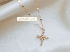 ∙ ∙ S P A R K L I N G ∙ C R O S S ∙ N E C K L A C E ∙ ∙ Made with the following: Gold Plated Cross 23mm x 9mm 14K Gold Filled Findings 14K Gold Filled Spring Clasp 14K Gold Filled Chain This listing is for one necklace. The third picture shows the necklace paired with the Mini Paperclip Necklace https://www.etsy.com/listing/985278174/ and the Sweet to the Soul Necklace https://www.etsy.com/listing/766035933/ (sold separately). ∙ ∙ H O W ∙ T O ∙ O R D E R ∙ ∙ Please select the chain and length fr Dainty Cross Pendant Necklace For Gift, Dainty Pendant Cross Necklace For Gift, Dainty Cross Pendant Necklace As Gift, Dainty Pendant Cross Necklace, Dainty Cross Necklace For Gift, Rose Gold Cross Necklace As A Gift, Delicate Cross Pendant Necklace For Gift, Delicate Cross Necklace Perfect As A Gift, Delicate Cross Necklace For Gift