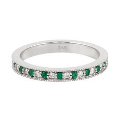 a white gold ring with emerald and diamonds