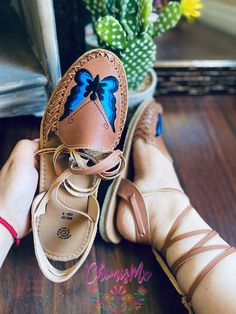 Beautiful mariposa lace-up/alpargata huaraches in white-cream and brown The strings are removable, and can become a regular huarache . So you GET 2 in 1 ♥️ The mariposa is beautifully embroidered in bright blue colors . Huaraches Mexicanos Hechos a mano en Mexico. Handwoven Mexican Huarache Sandals Handmade in Mexico. There is nothing like an authentic handmade huarache. Our huaraches are made with the classic traditional craftsmanship, but with a modern design. The handwoven techniques allow th Artisan Leather Huaraches For Festivals, Leather Huaraches For Festivals With Round Toe, Handmade Leather Huaraches For Festivals, Adjustable Brown Huaraches For Festival, Artisan Leather Huaraches, Leather Closed Toe Huaraches For Festival, Artisan Huaraches With Round Toe For Festivals, Artisan Festival Huaraches With Round Toe, Artisan Huaraches With Adjustable Fit And Round Toe