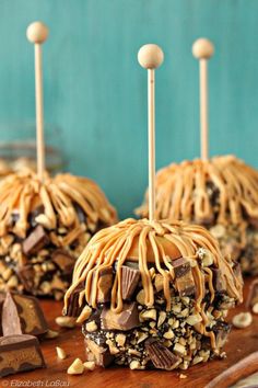 chocolate caramel pretzel pops with peanut butter drizzles on top