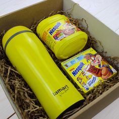 an open box with two yellow items in it