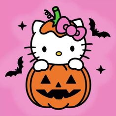 a hello kitty sitting on top of a pumpkin