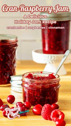 cran - raspberry jam in a glass jar with spoon on the table