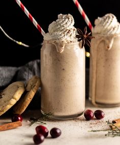 two glasses filled with whipped cream and cookies