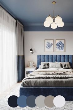 a bedroom with blue and white colors on the walls, carpeting and bedding