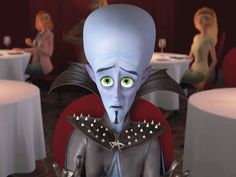 an animated character with green eyes sitting at a table in front of two other people