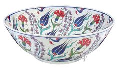 a white bowl with red and blue designs on it